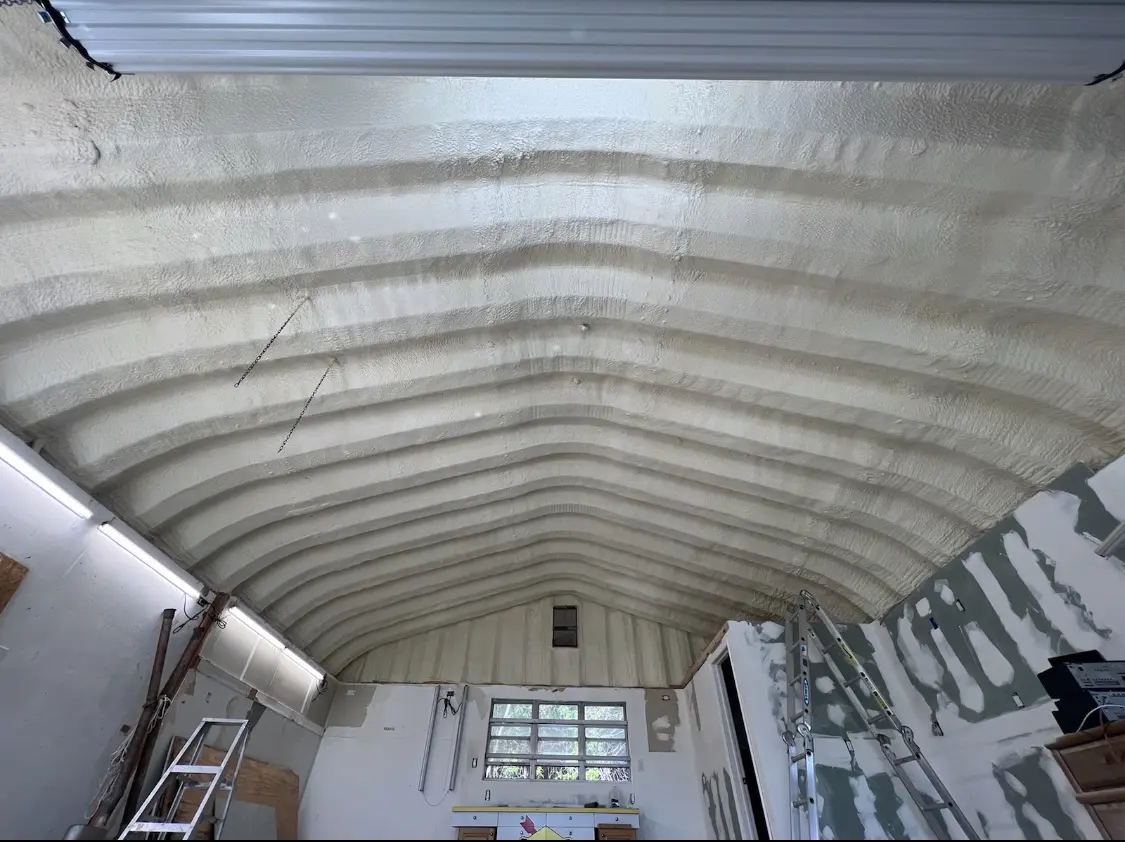 Spray polyurethane foam applied to the underside of a metal roof deck in Lake Park