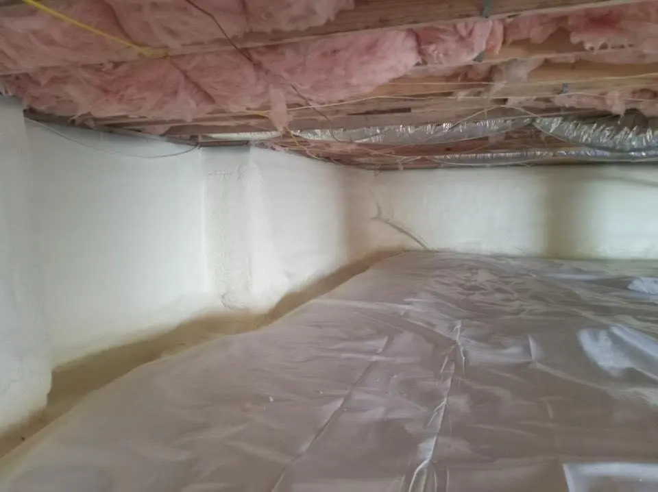 Crawl space encapsulation with closed-cell spray foam for Commercial Roof Restoration in Lake Park